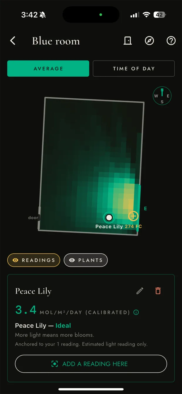 Plant Light Meter room light map showing modeled daylight across a room floor with a placed Peace Lily