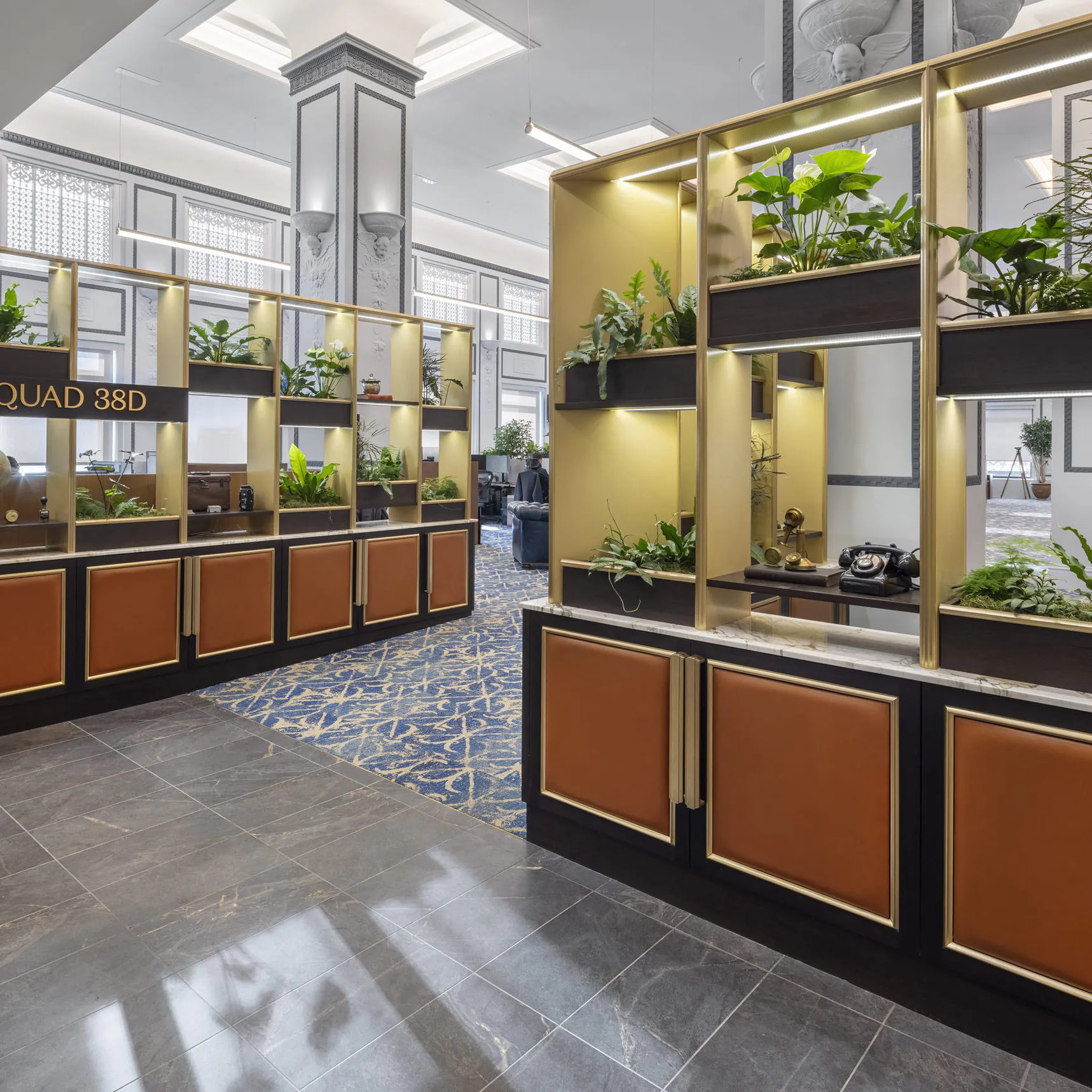 Lush biophilic plant installation within the elegant historic interior of a global investment firm