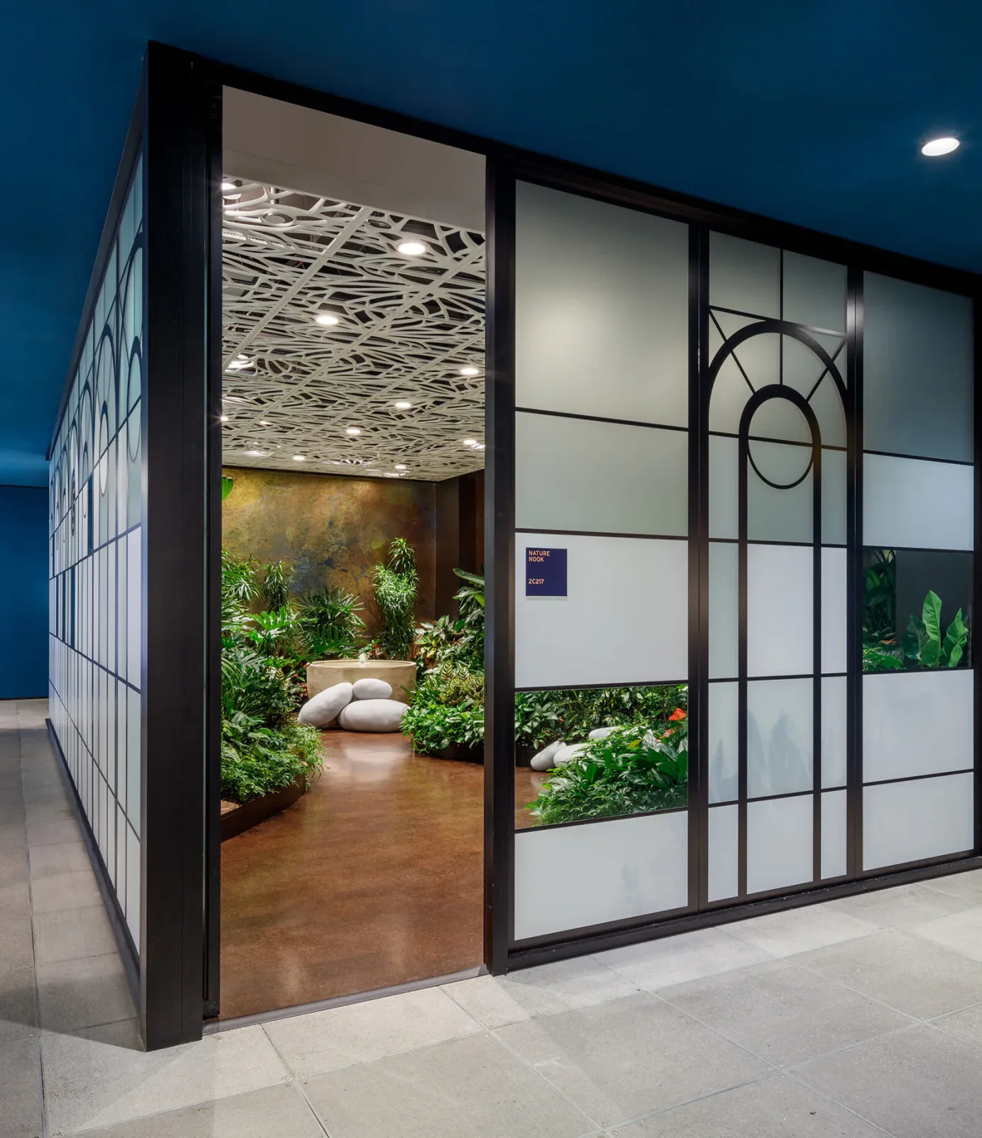 Wide view of the Nature Nook wellness space showing the full plant installation